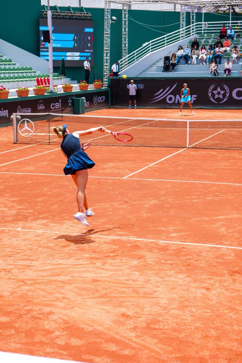 Tennis player jumping forehand