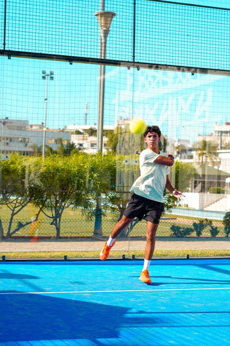 Padel player preparing a shot