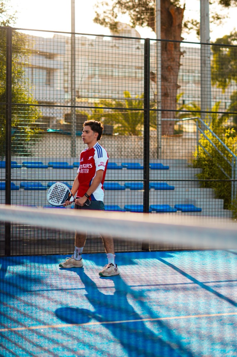 Padel player returning the ball